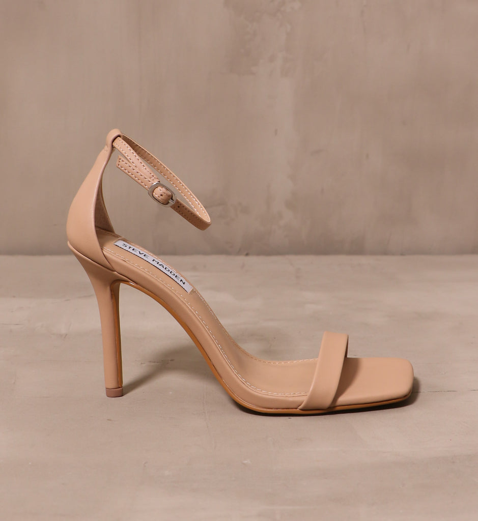 outer side of the care to dance heel with thin ankle strap and bridge strap with thin stiletto heel