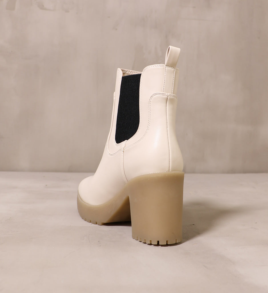 back of the chunky rubber block heel and off white cream upper on the chelsea you around boot