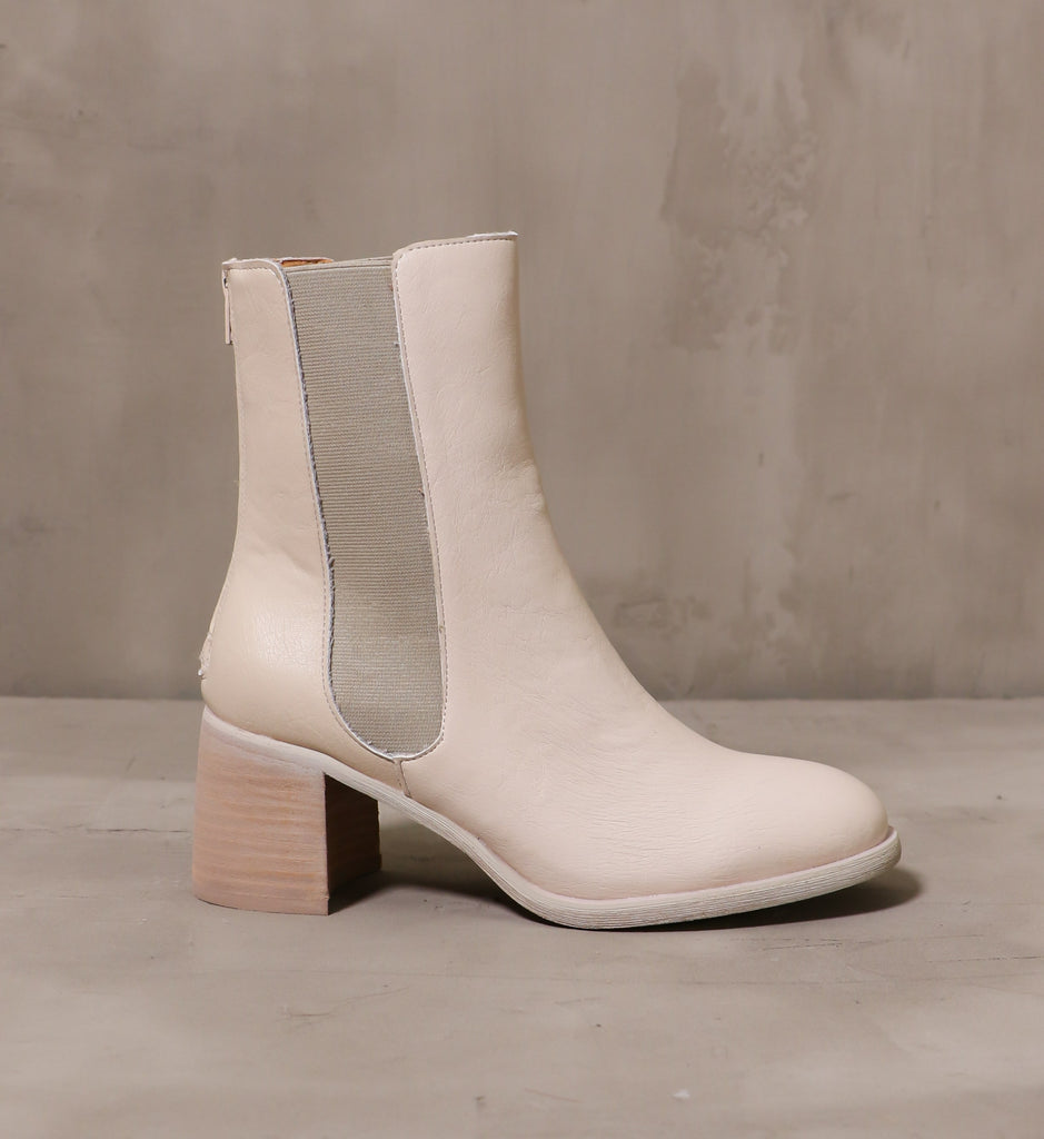 outer side of the off white consider it done boot with elastic gore panel and stacked wood block heel