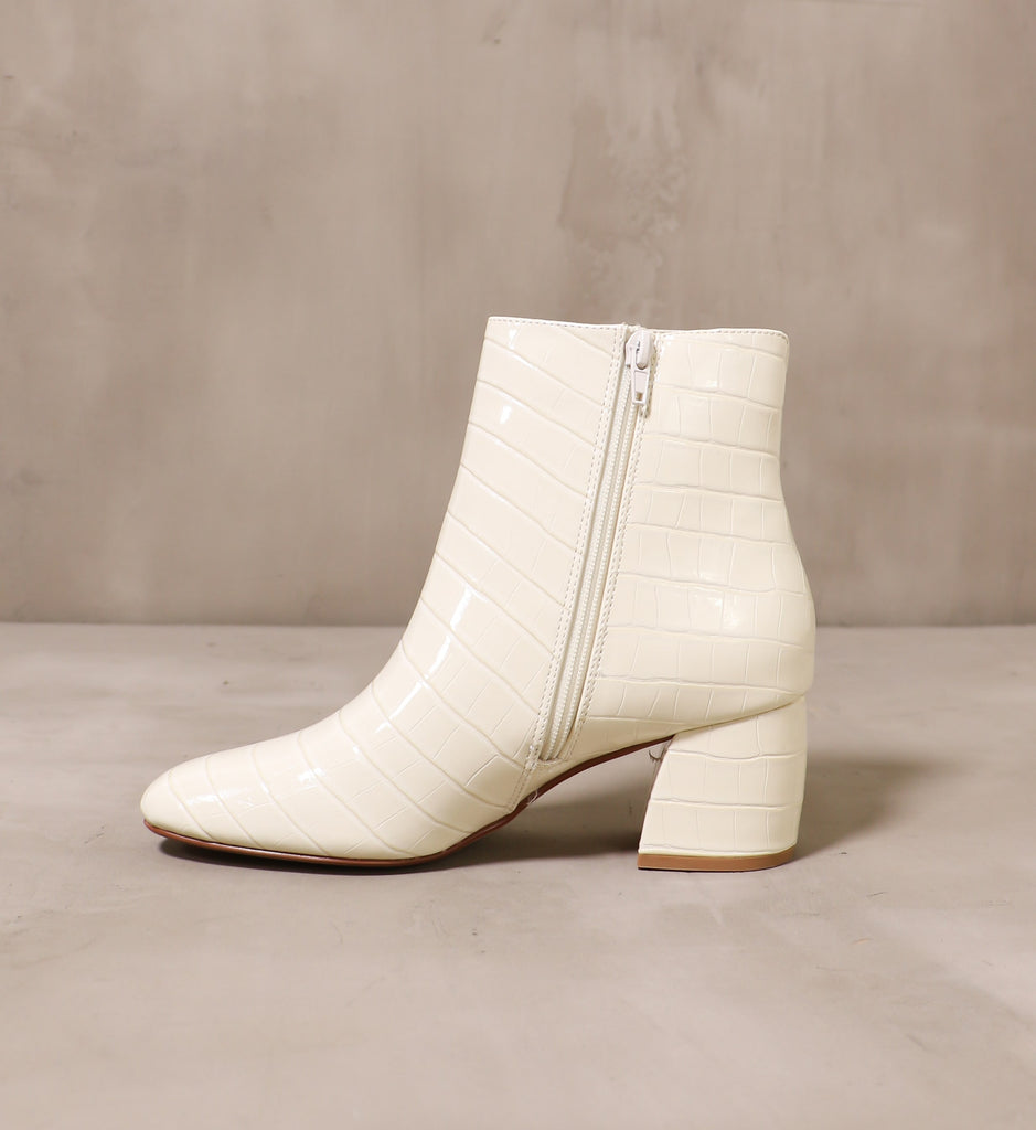 inner side of the off white zipper and upper on the croc block bootie