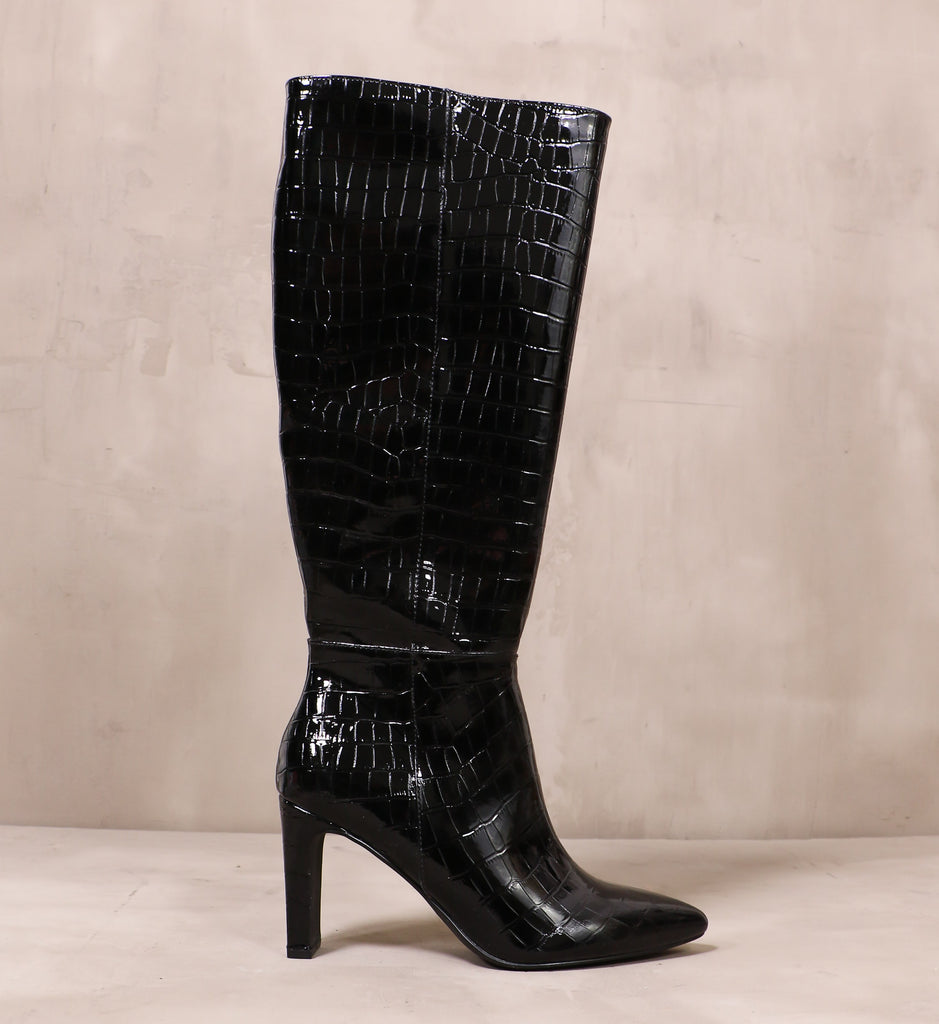 outer side of the croc on babe tall boot with patent black textured upper