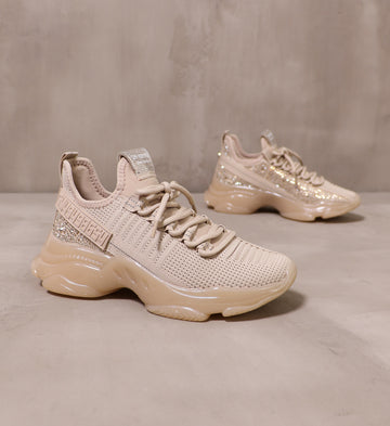 diamond in the blush sneakers angled on cement background