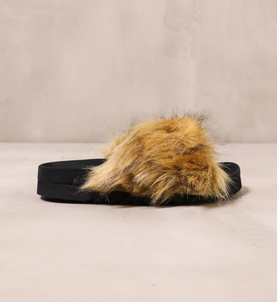 outer side of the tan fur strap on the don't furry about me slide