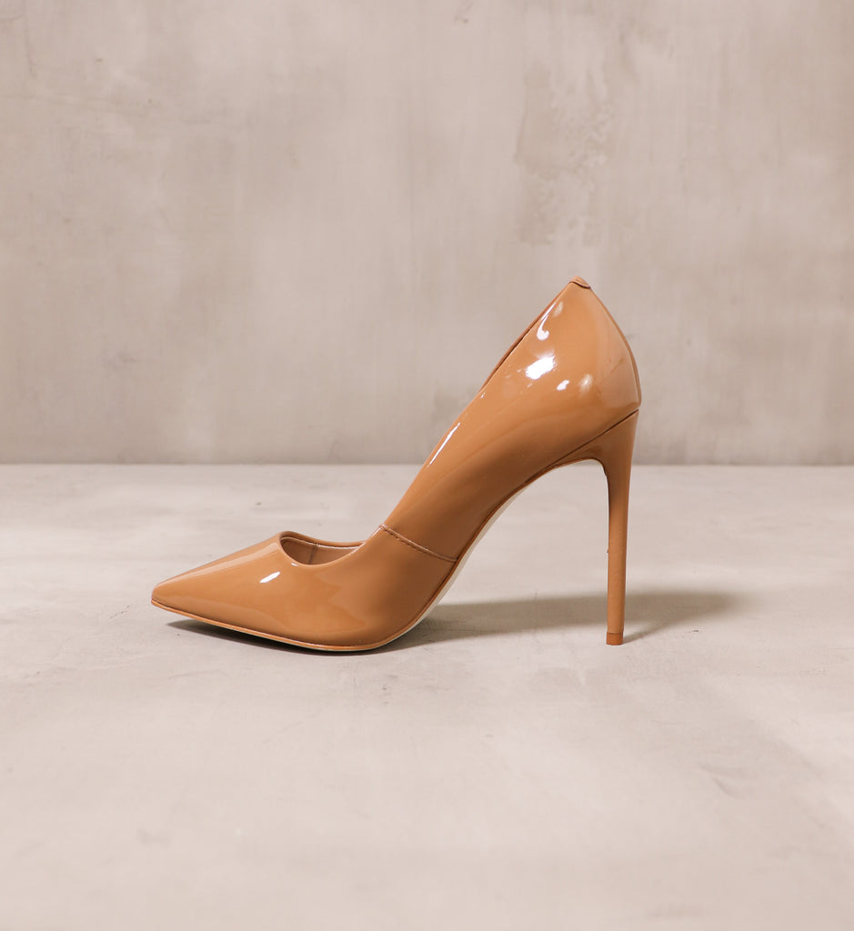 inner side of the tan patent leather double pump latte heel with thin stiletto