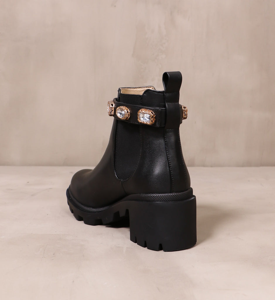 back of the leather drip'in diamonds boot with black rubber lug heel