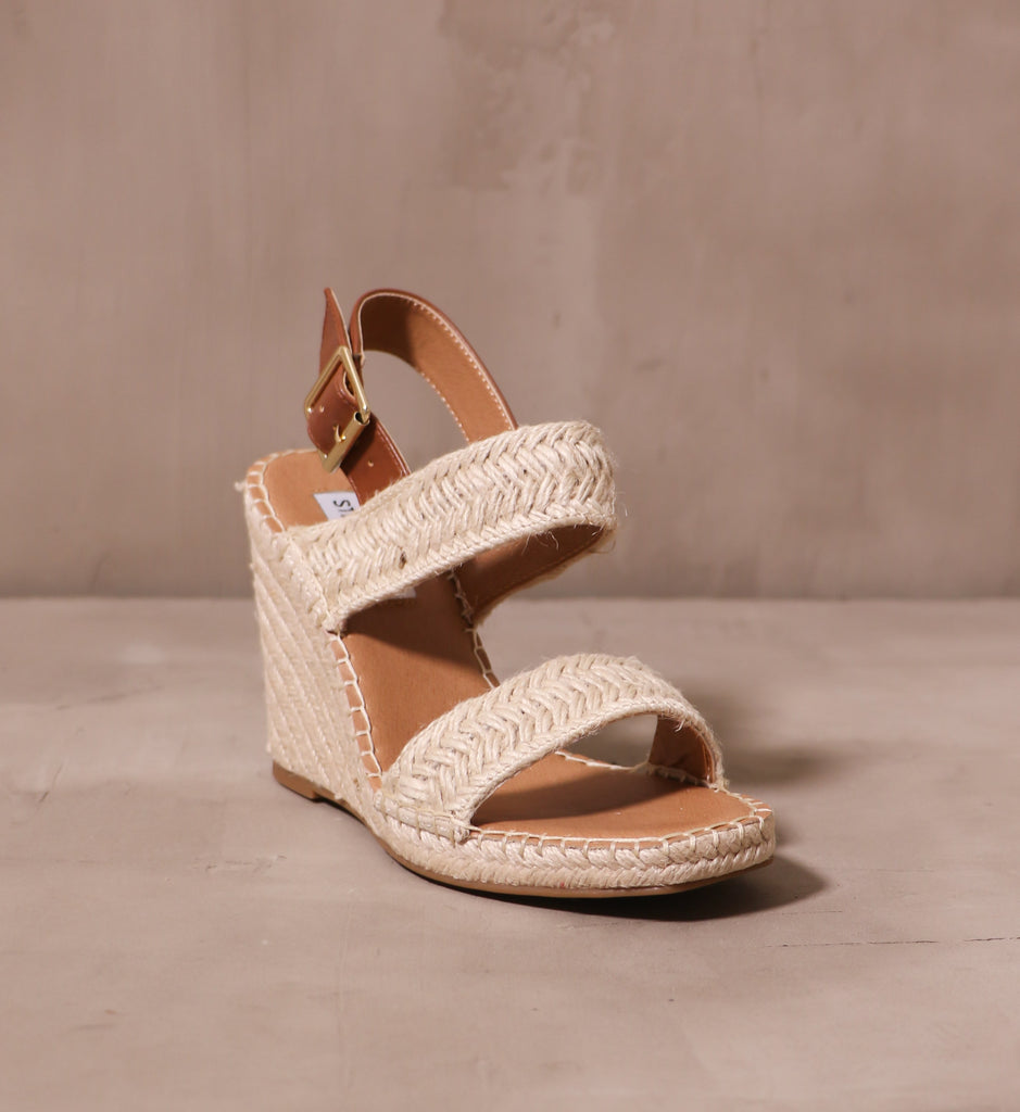 front of the open toe espadrille you be mine wedges with tan leather insole and raffia straps