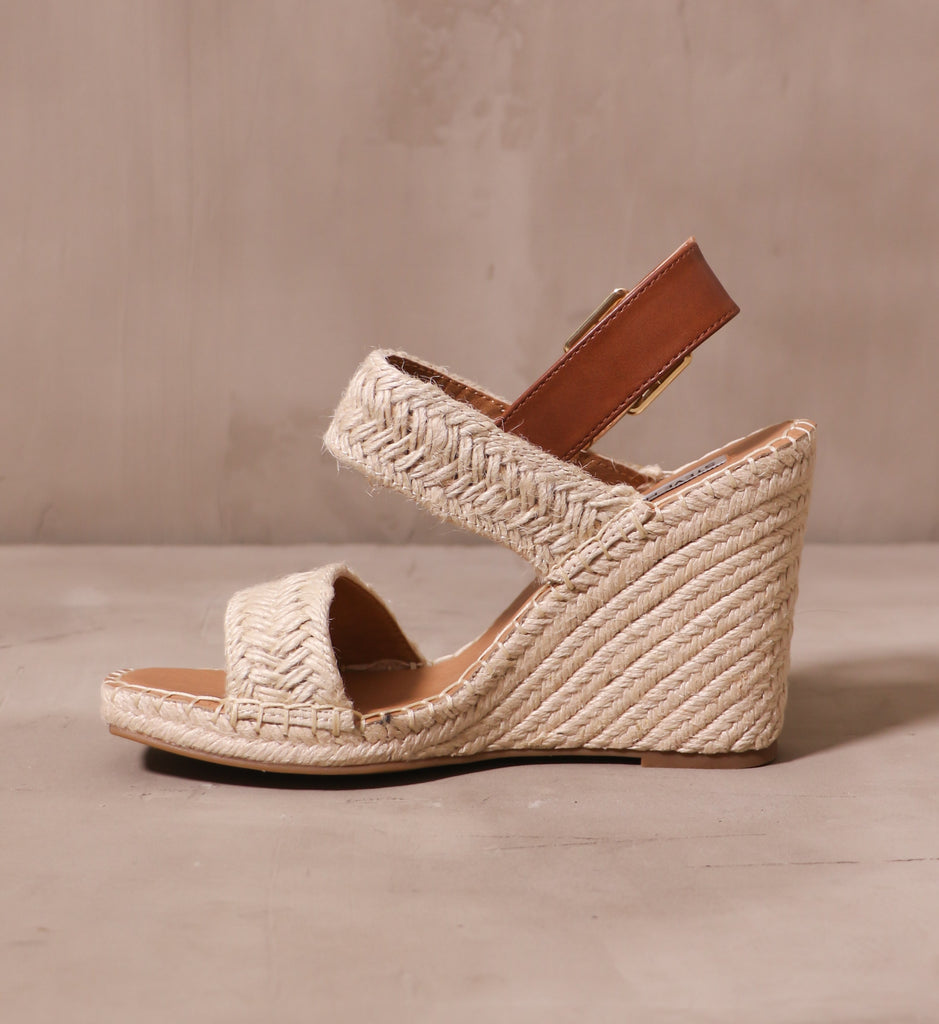 inner side of the espadrille you be mine wedge with two raffia straps and tan leather back strap