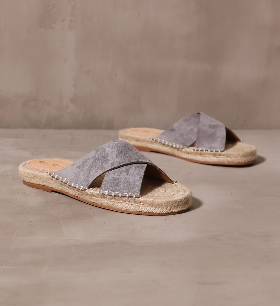 a pair of espadrille you go with me slide with gray criss cross strap on esparto rope insole