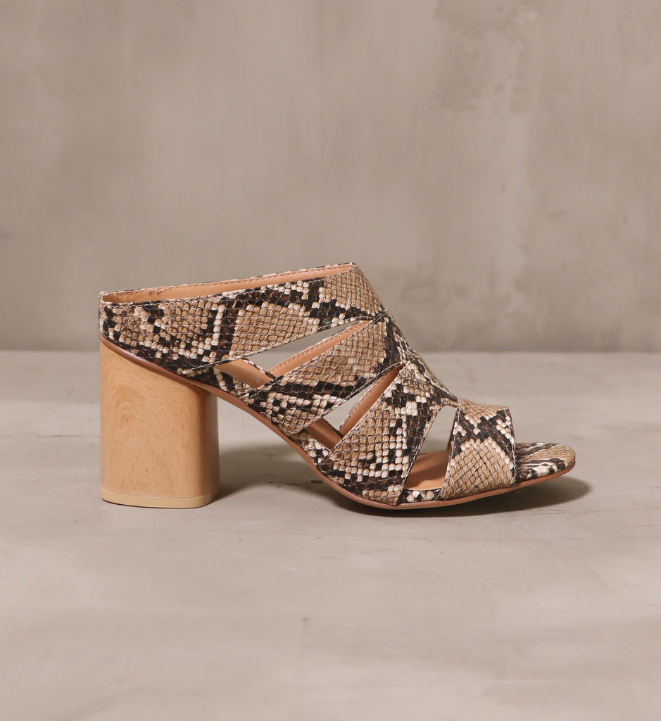 outer side of the fierce and free heel with solid square block heel on cement background