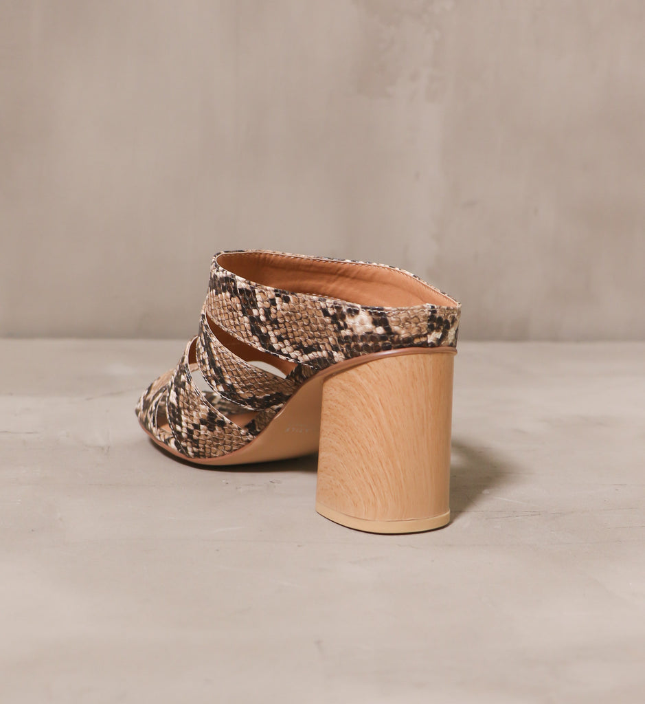 back of the light wood block heel with slip on open back and brown textured upper