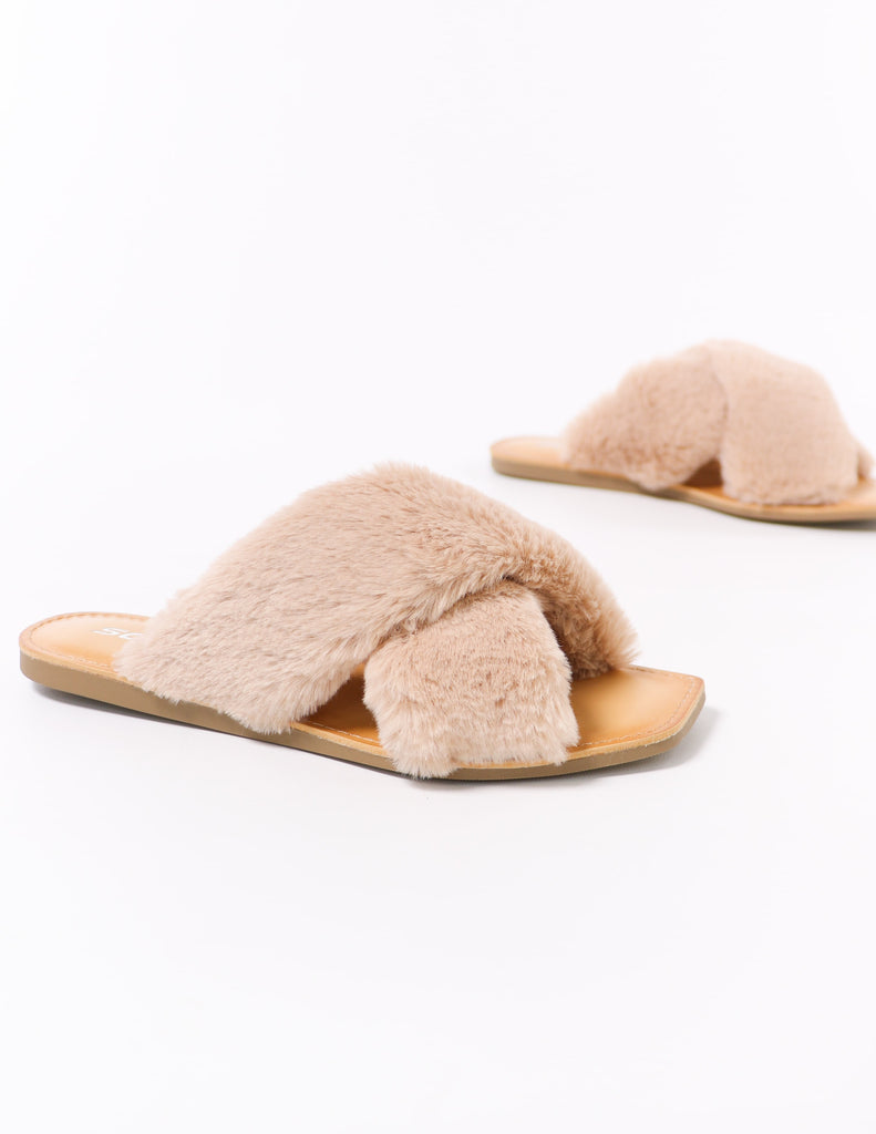close up of the natural fuzzy business women's faux fur slides