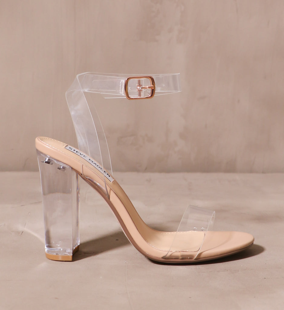 outer side of the home before midnight heel with rose gold buckle on clear straps