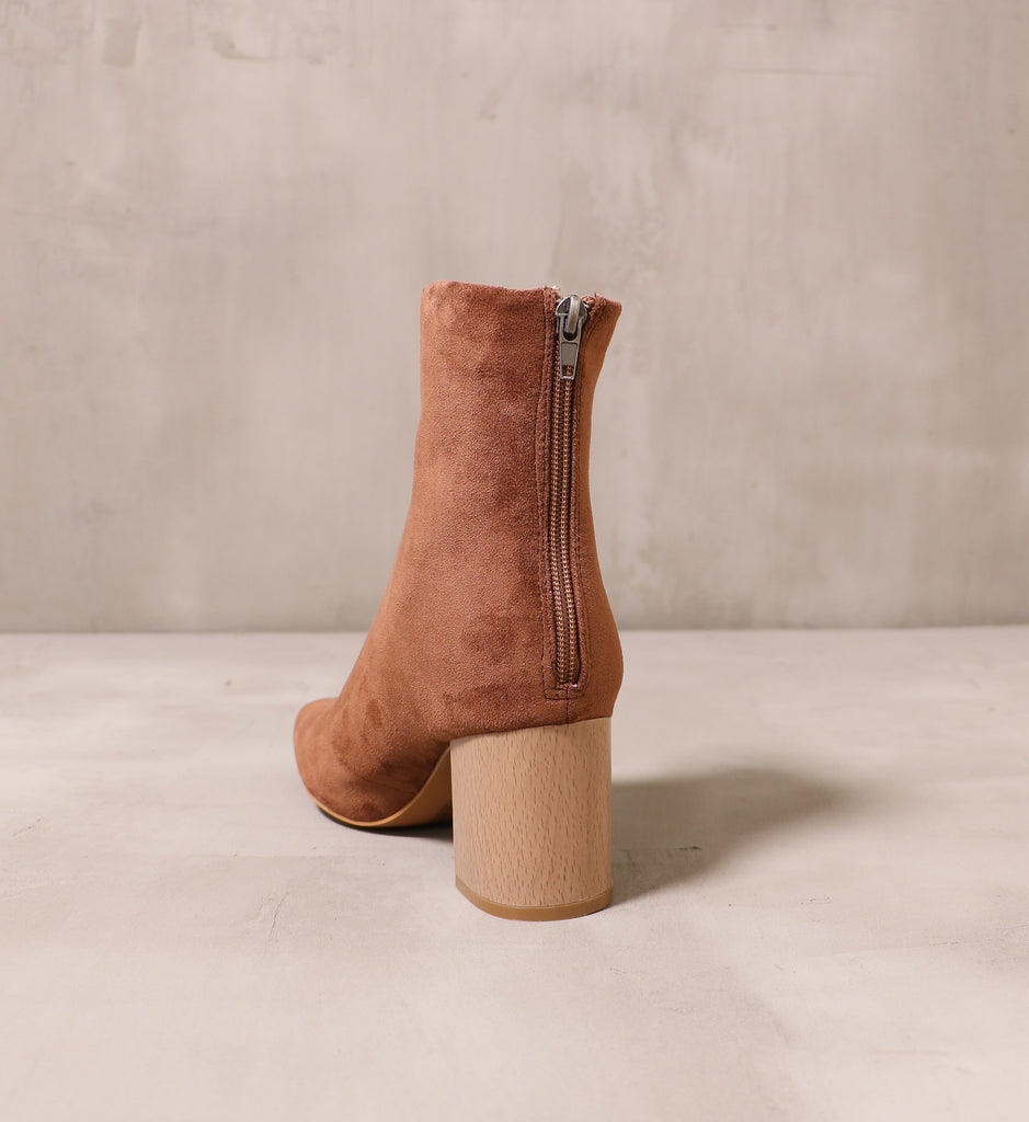 back of the zipper detail on the back of the keepin' it casual brown ankle boot with wood block heel