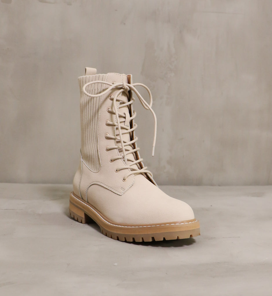 kickin' knit lace up boot with rounded toe angled towards the front