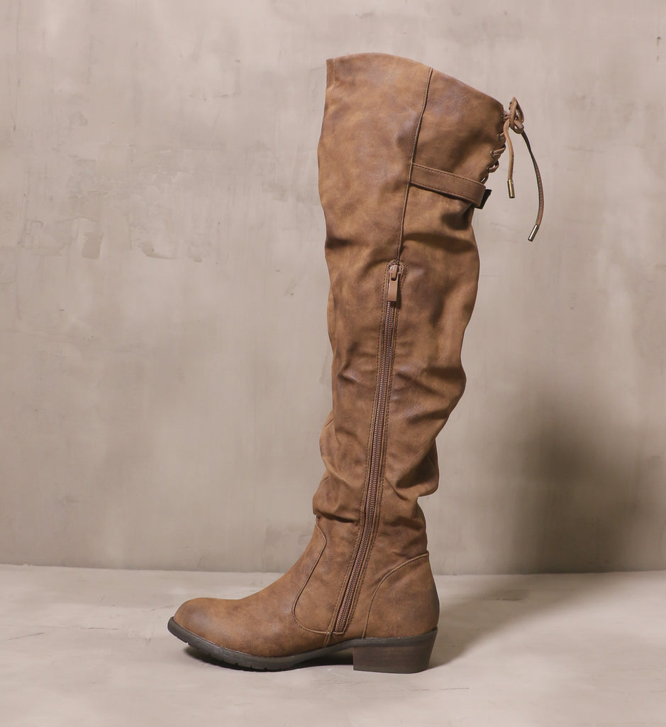inner side of the I knee'd a coffee boot with long brown zipper and brown sole