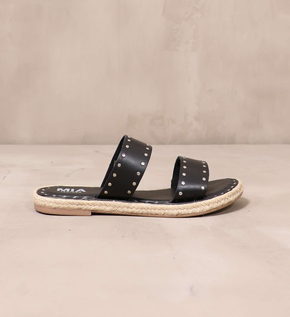 outer side of the let the stud times roll sandal with rope trim and brown sole