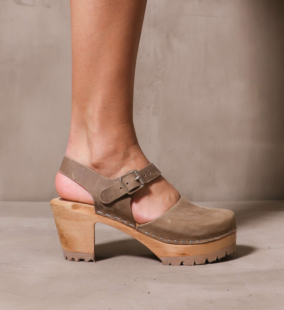 outer side of the taupe khaki abba swedish clog with solid wood platform sole