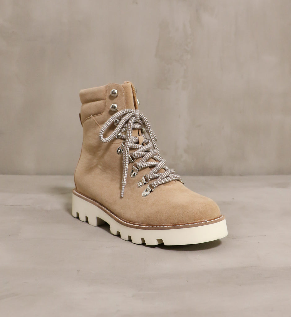 front of the neutral territory round toe boot angled on cement background