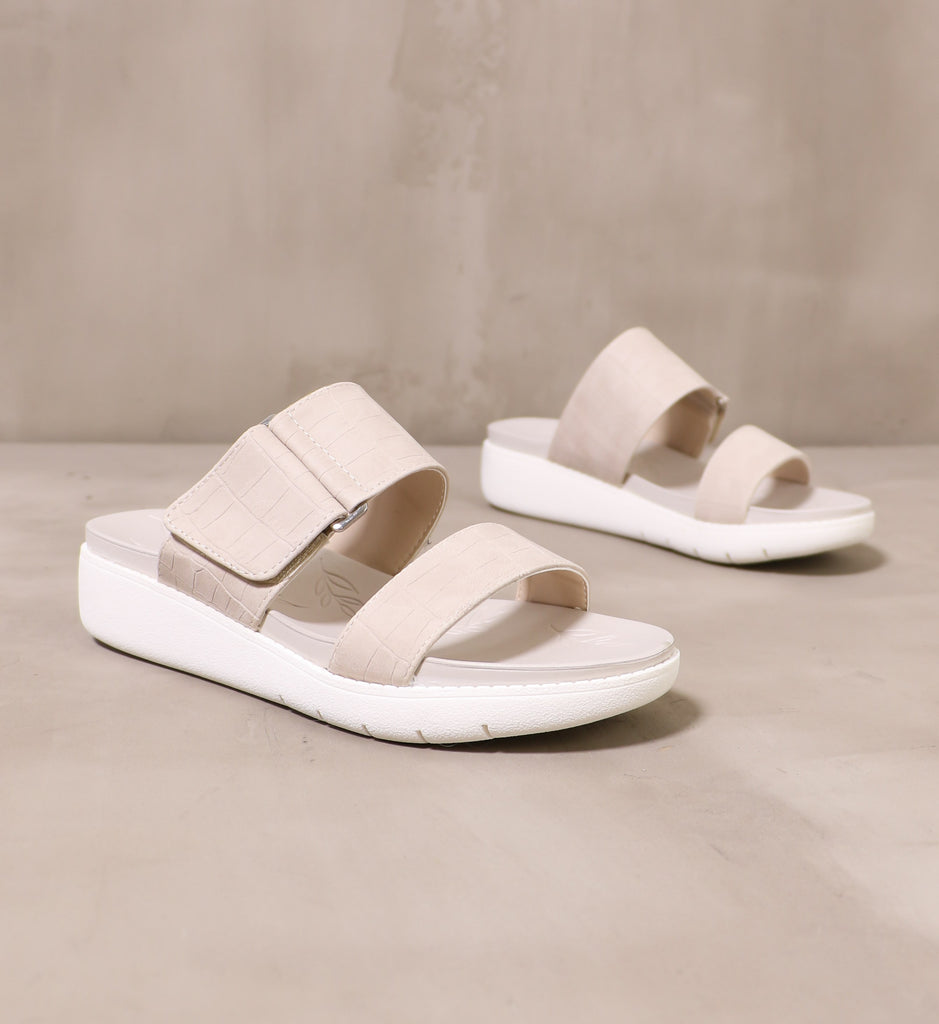 pair of off white one two strap sandal with chunky white rubber sole