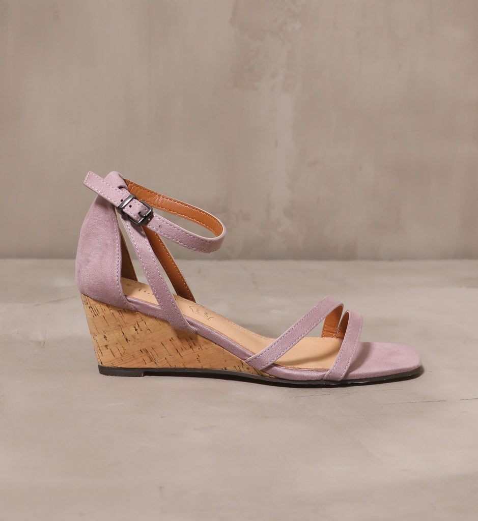 outer side of the thin straps and silver buckle detail on the lavender purple pastel me you love me wedge