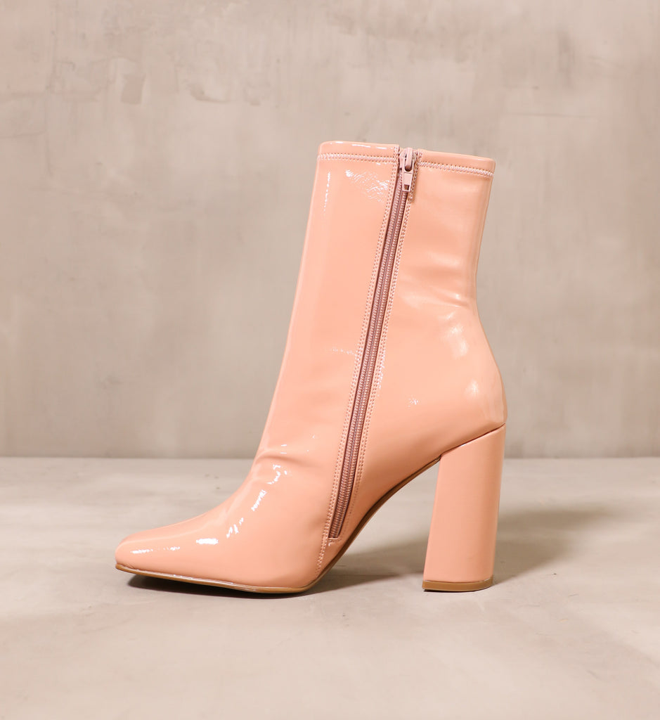inner side of the blush zipper on the pink big faux patent leather boot