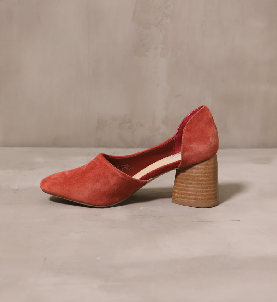 inner side of the retro romance heel with cutout d'orsay silhouette and rust suede upper