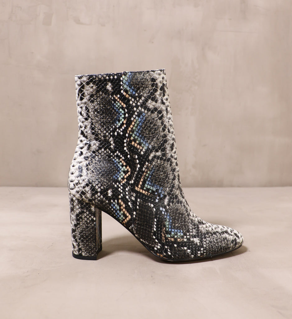 outer side of the black textured slither over here boot with block heel