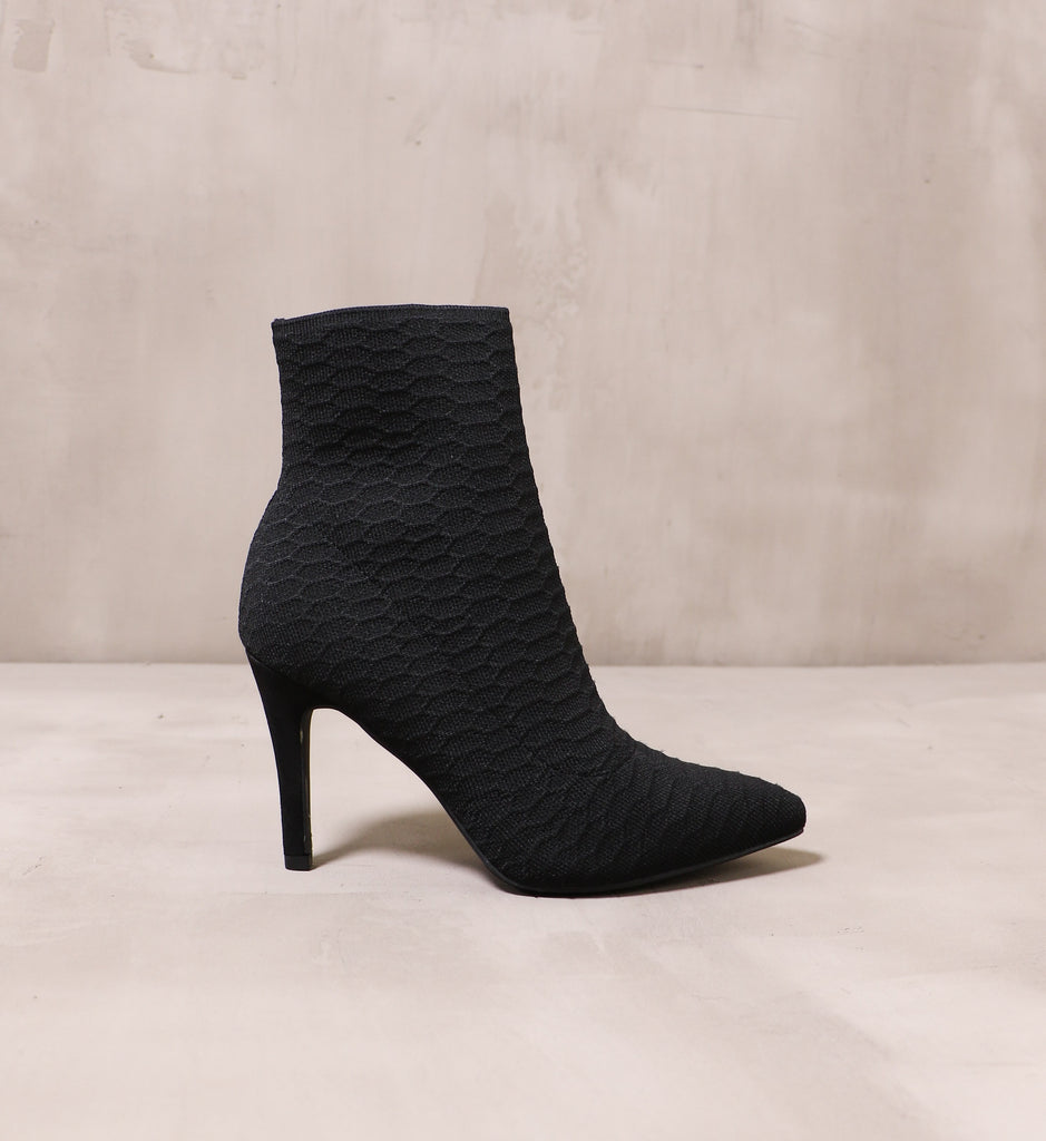 outer side of the sock it to me bootie with textured fabric upper