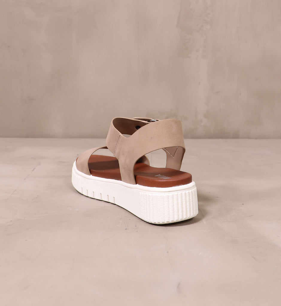 back of the chunky white platform sole and brown leather insole on the sole mate platform sandal