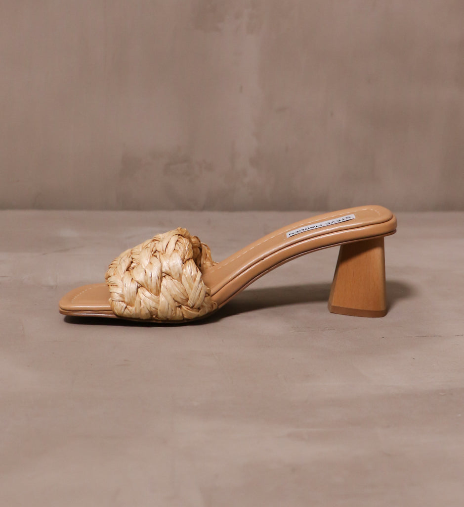 inner side of the last straw heel sandal with faux wood carved block heel and tan leather insole