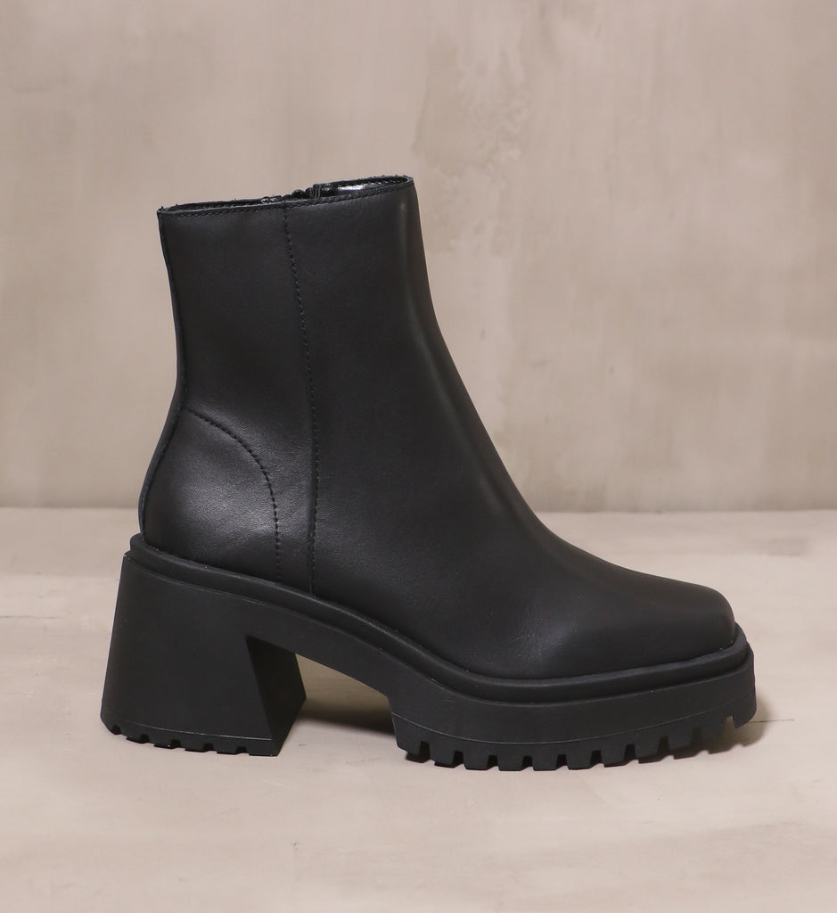 outer side of the leather upper and chunky rubber block heel and tread on the shadow of a doubt boot