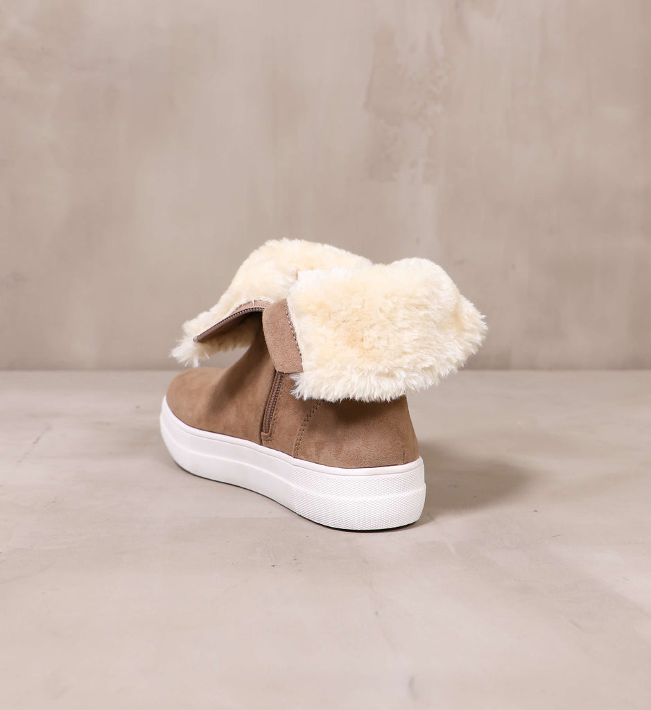 back of the taupe upper and cream fur lining on the taupe take it outside convertible sneaker