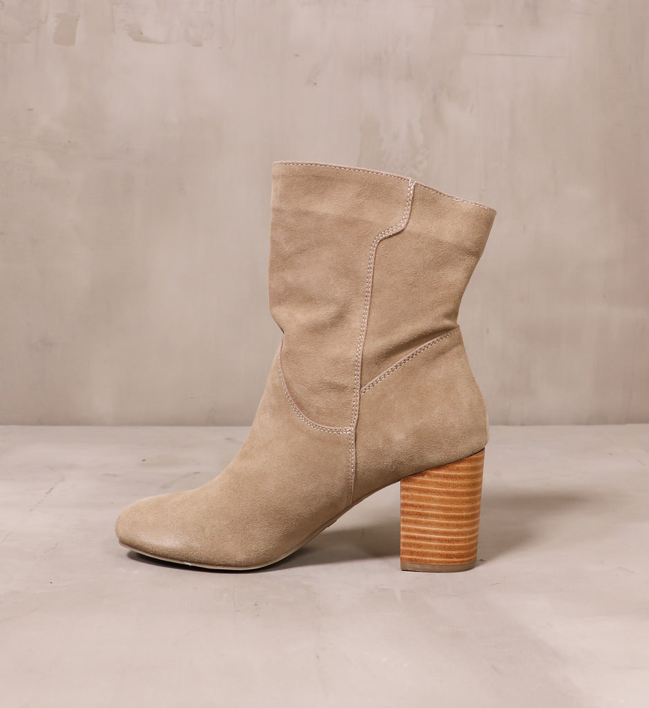 inner side of the thanks a scrunch block heel bootie with suede leather upper