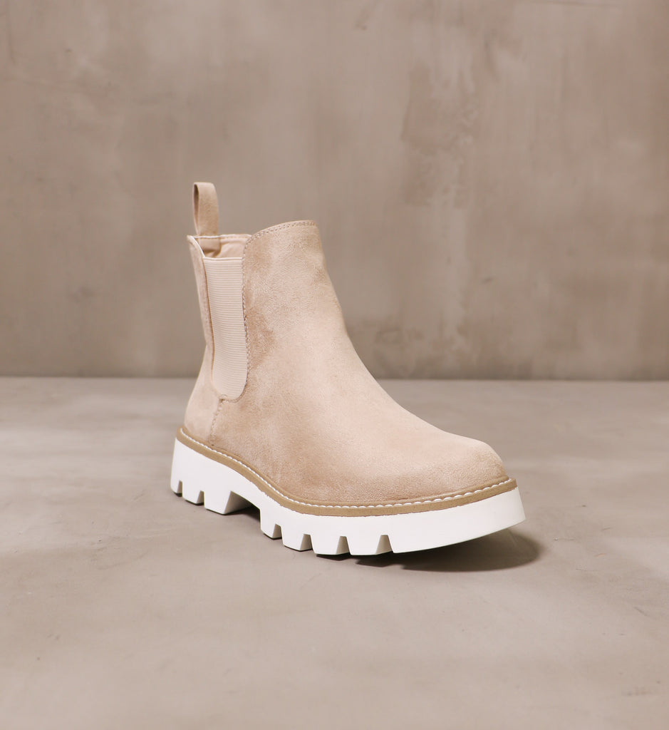 front of the round toe the feeling is neutral bootie with white rubber tread