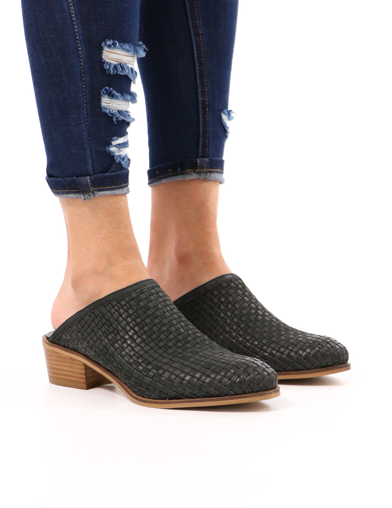 model standing in black the woven one mule with almond toe - elle bleu shoes