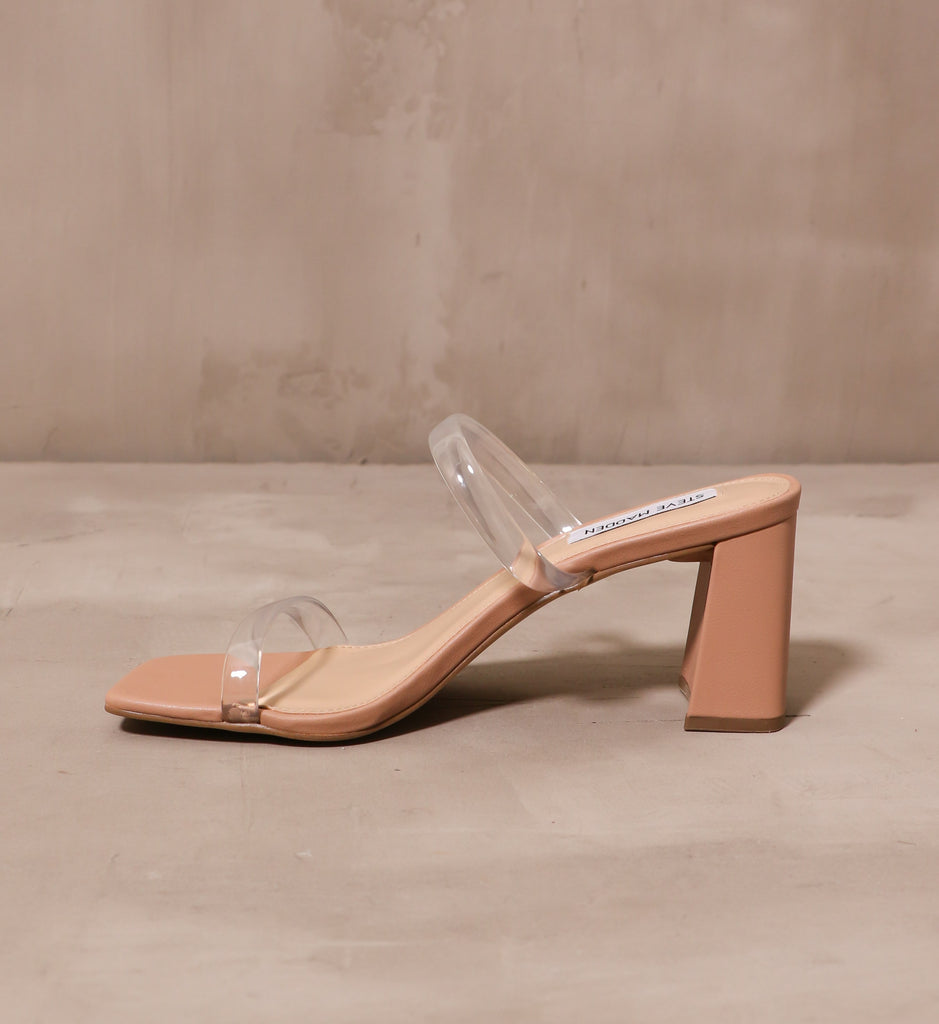 inner side of the tan sole of the transparently timeless block heel with clear thin straps