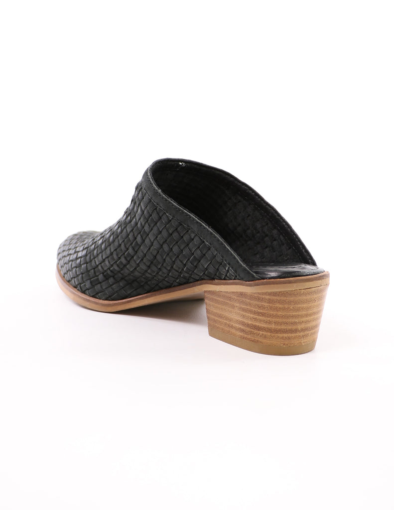 back of the volatile the woven one black mule with stacked wood block heel on white background - elle bleu shoes