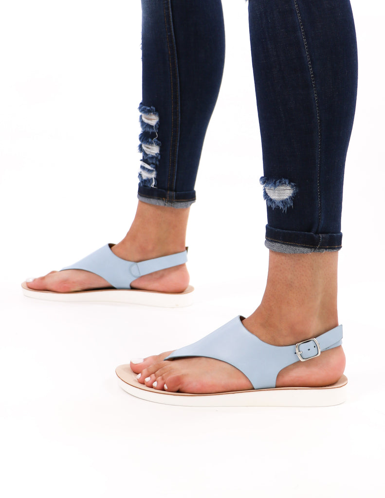 model standing in blue walk with me lightweight vegan leather sandals and distressed denim - elle bleu shoes