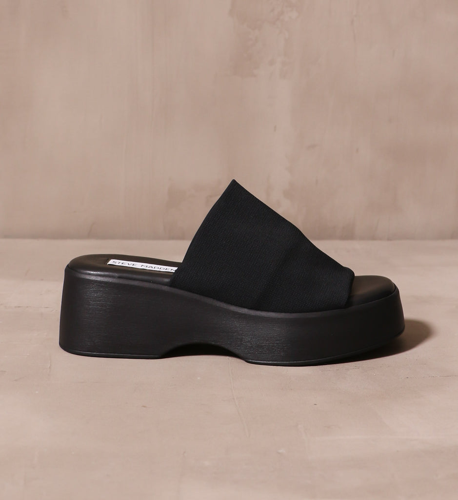 outer side of the what a girl wants sandal with chunky black platform and thick fabric strap