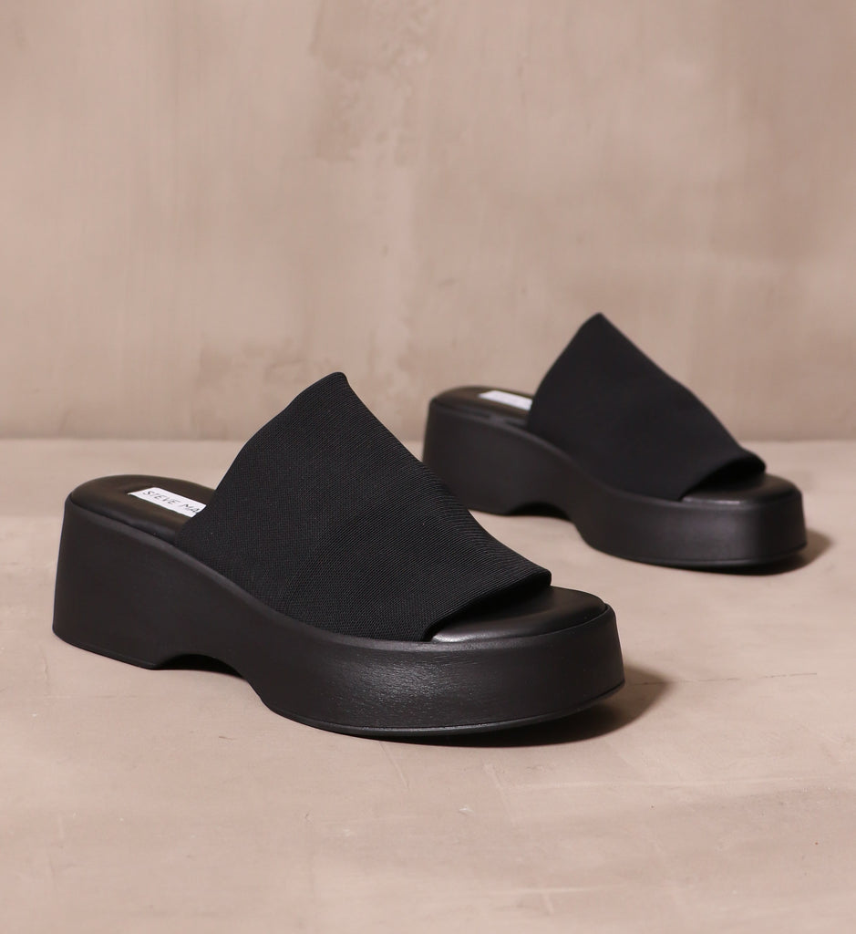 black what a girl wants platform sandals with stretchy fabric strap across the bridge of the shoes