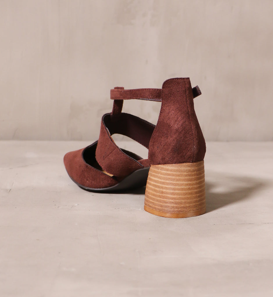 back of the stacked wood block heel and textured suede upper on the wine and dine heel